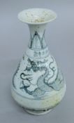 A Chinese blue and white pottery dragon vase. 25.5 cm high.