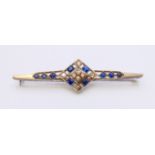 An unmarked Art Deco white gold or platinum diamond and sapphire brooch. 7 cm long. 7.