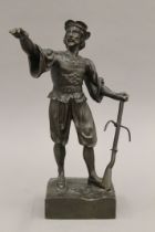 A 19th century bronze model of a man with a crossbow. 32 cm high.
