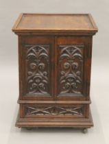 A small Victorian carved oak Revival cabinet with base drawer. 51.5 cm square.
