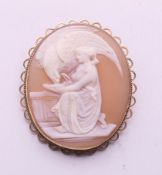 A 9 ct gold mounted cameo brooch depicting Hebe feeding eagle of Zeus. 4.5 cm high.