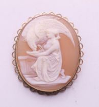 A 9 ct gold mounted cameo brooch depicting Hebe feeding eagle of Zeus. 4.5 cm high.