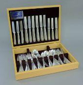 A composite 12-setting canteen of Old English pattern silver flatware. The canteen 13.5 cm wide.