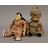 Two vintage Chinese dolls. Approximately 24 cm high.