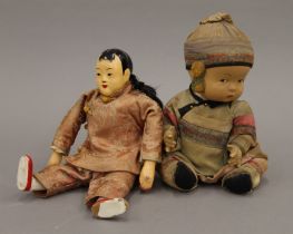 Two vintage Chinese dolls. Approximately 24 cm high.