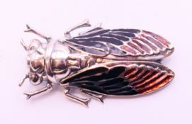 A silver beetle brooch. 5 cm long.