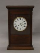 An late 19th/early 20th century walnut-cased wall clock, the dial inscribed Valogne, Paris.