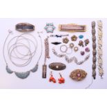 A quantity of various jewellery, including brooches, earrings and a silver ingot pendant necklace.