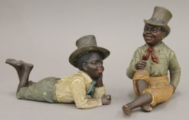 Two 19th century pottery figures of young boys. The largest 13.5 cm high.