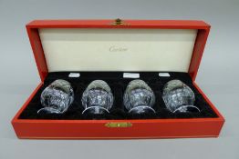 A boxed set of Cartier cut glass brandy glasses. Each 8.5 cm high.