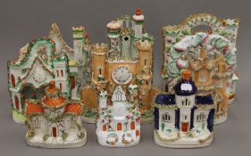 Nine Staffordshire houses. The largest 28.5 cm high.