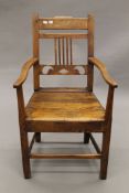 A 19th century oak open armchair. 55 cm wide.