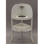 A painted 19th century corner washstand. 117 cm high.