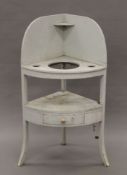 A painted 19th century corner washstand. 117 cm high.