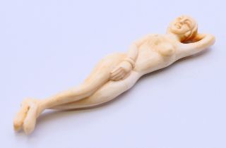A bone doctors figure of a female. 13 cm long.