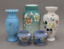 A quantity of opaline glass vases. The largest 30 cm high.