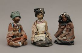 Three Elizabeth Rowland pottery South African figures, each signed to base,