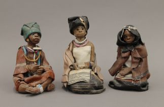 Three Elizabeth Rowland pottery South African figures, each signed to base,