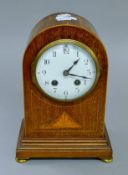 An Edwardian inlaid mahogany mantle clock. 26 cm high.