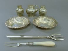 A quantity of various silver including a pair of embossed dishes, a cruet set etc.