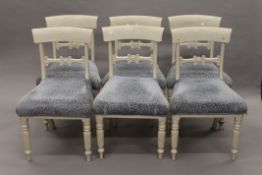 A set of six white painted mahogany dining chairs and two painted kitchen chairs.