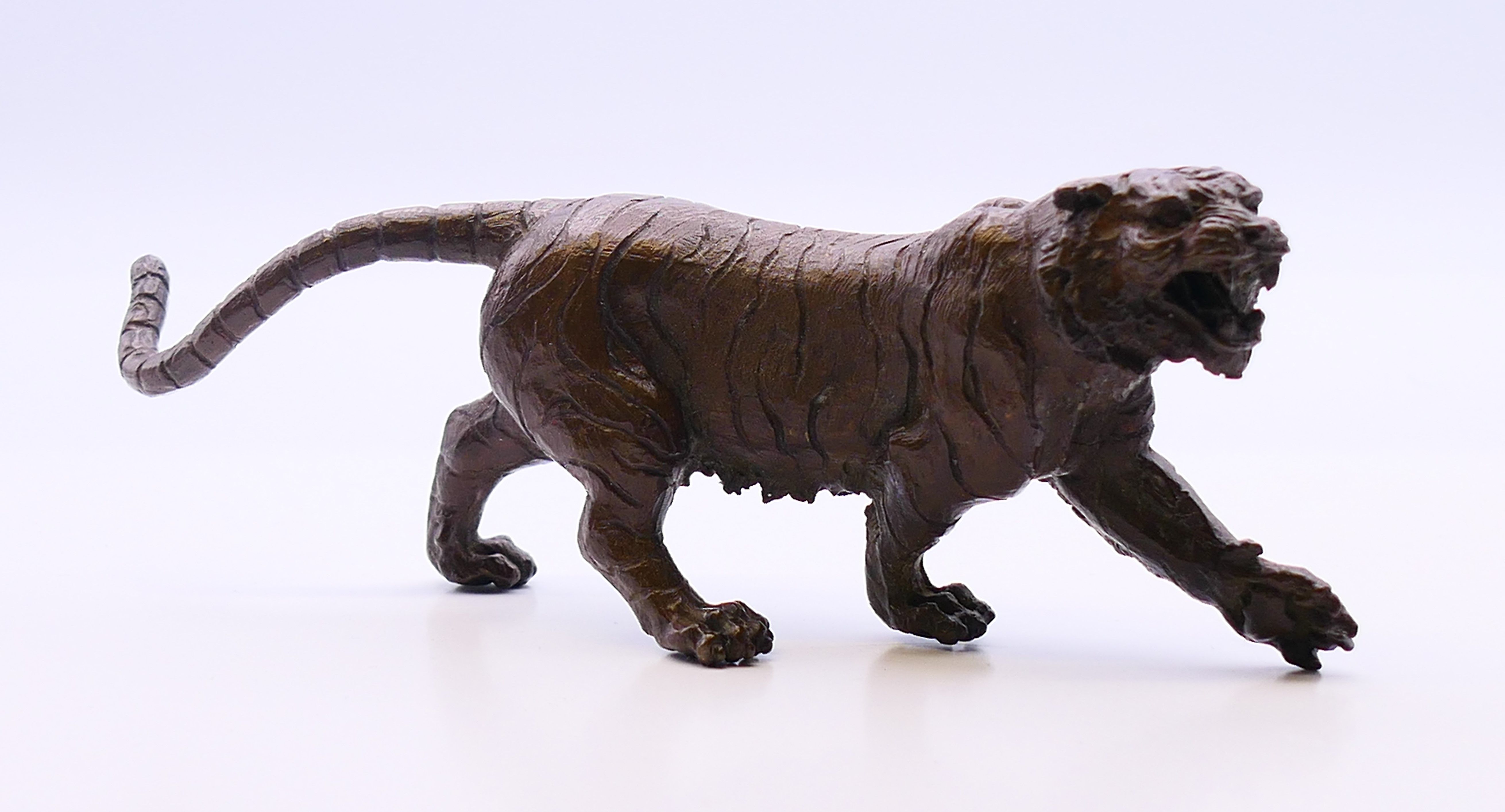 A bronze model of a tiger. 12 cm long, 5 cm high. - Image 2 of 4