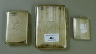 Two silver cigarette cases and a silver matchbook case. The largest 12 cm long. 10.