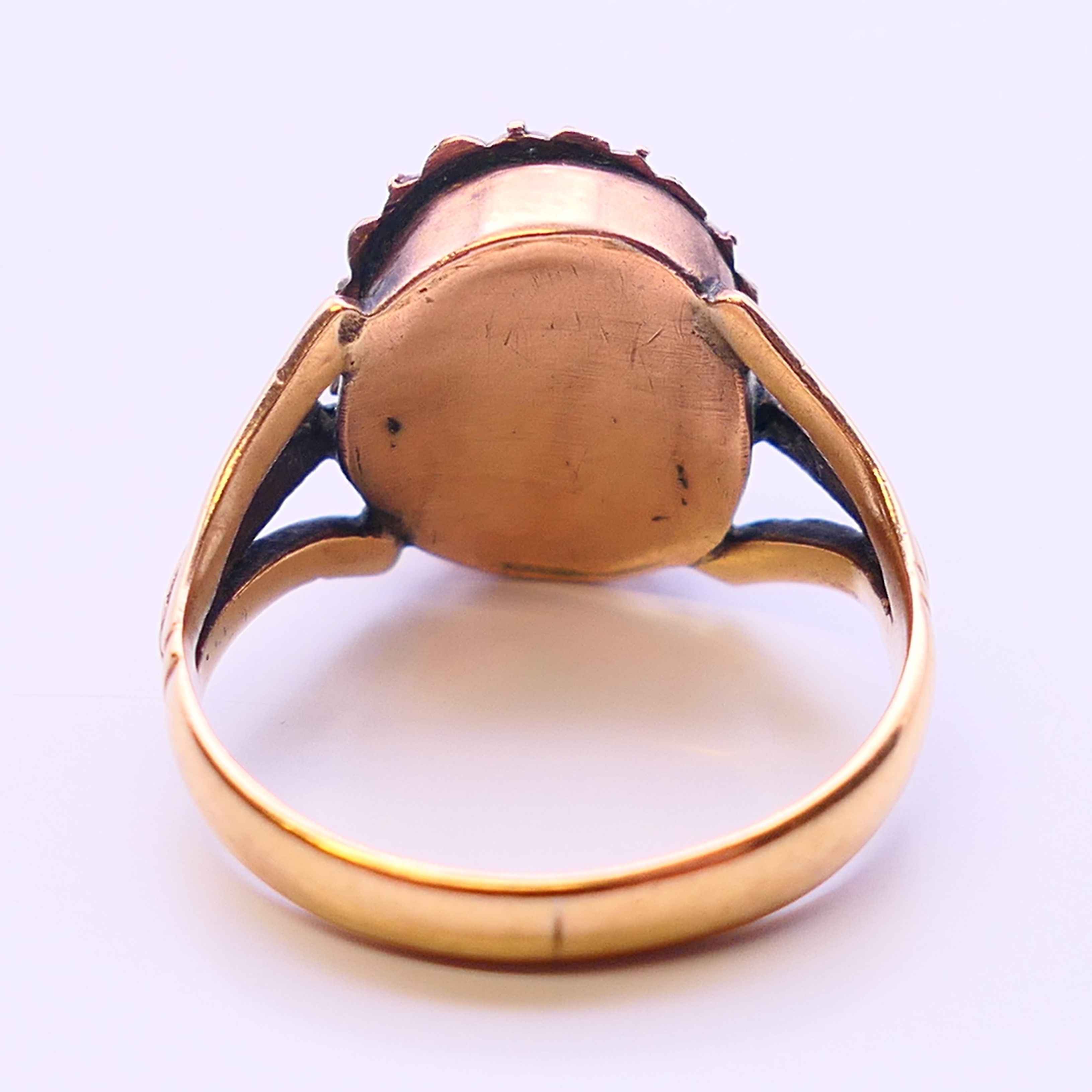 A Georgian unmarked gold Imperial topaz and seed pearl ring. Ring size N. - Image 4 of 5
