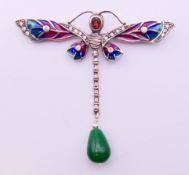 A silver dragonfly brooch. 7 cm high.