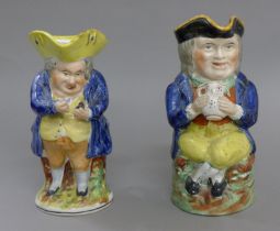 Two 19th century Toby jugs. The largest 22 cm high.