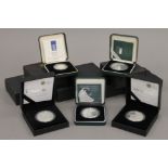 Twelve boxes Royal Mint proof silver coins.