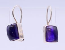 A pair of silver and amethyst earrings. Amethyst 1 cm x 0.75 cm.
