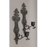 A pair of wrought iron wall sconces. 50 cm high.