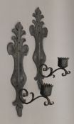 A pair of wrought iron wall sconces. 50 cm high.