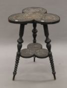 A Victorian carved trefoil table. 48 cm wide.