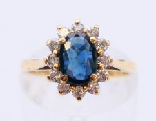 A 9 ct gold diamond and sapphire ring. Ring size J/K.