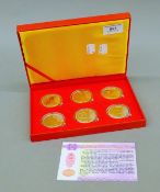 A set of six Chinese commemorative coins in the original box. The box 20.5 cm wide.