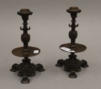 A pair of 19th century bronze candlesticks. 23 cm high.