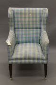 A late 19th/early 20th century upholstered armchair. 73 cm wide.