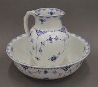 A Furnivals blue Denmark pattern wash jug and bowl. The jug 29 cm high.