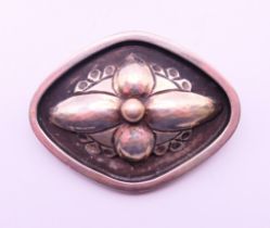 A Georg Jensen silver flower brooch. 4 cm x 3 cm.