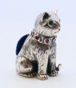 A silver cat pin cushion. 2.75 cm high.