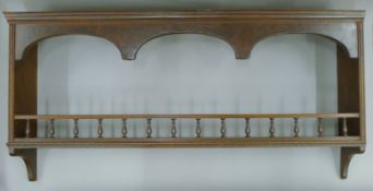 A Victorian hanging shelf. 112 cm wide.
