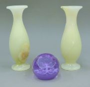 A pair of onyx vases and a Caithness paperweight. The former each 19 cm high.