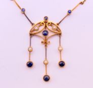 An unmarked gold Art Nouveau pendant on a gold chain 3.5 grammes.