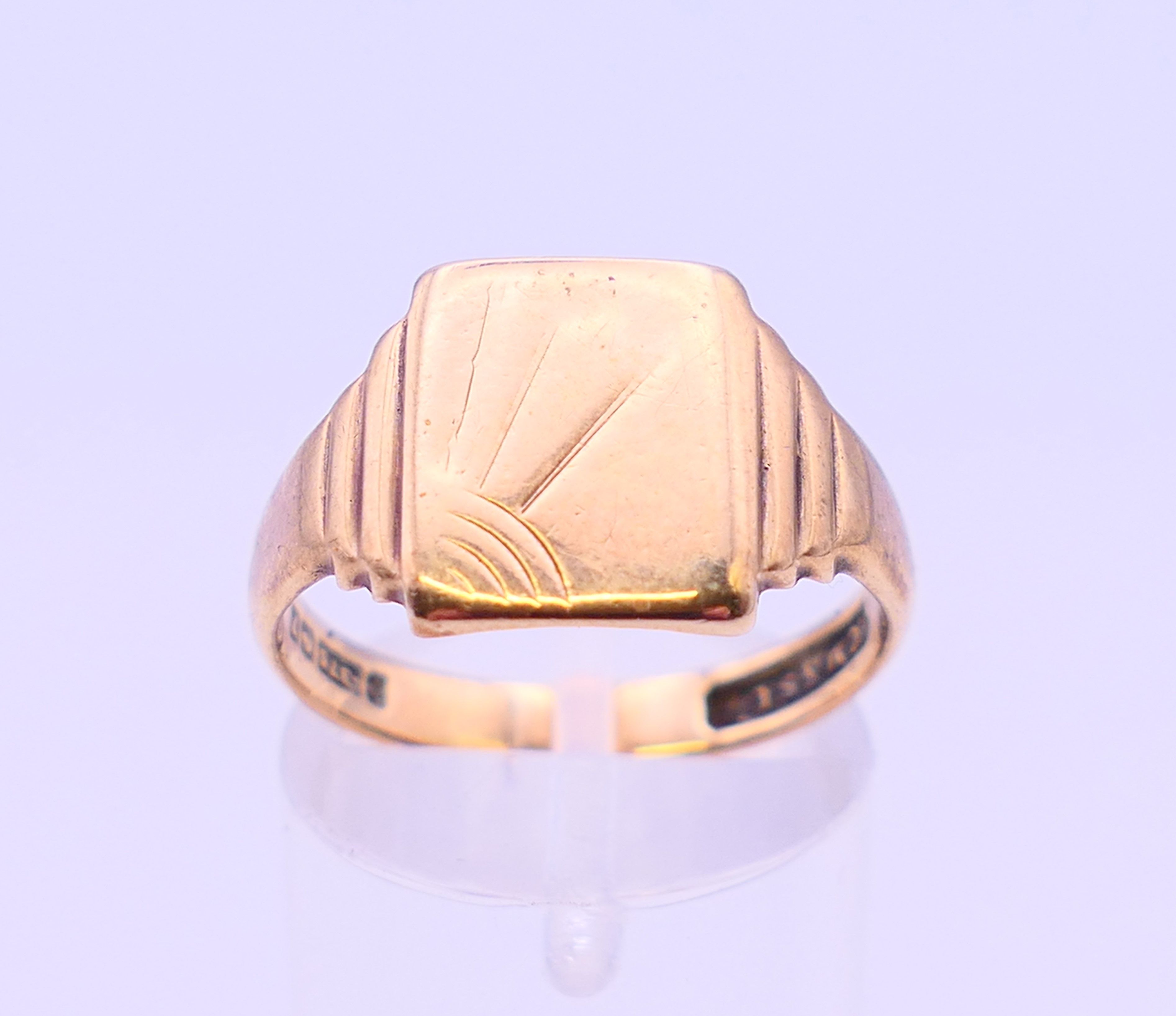 A 22 ct gold wedding band 3.8 grammes, a 9 ct gold wedding band and a 9 ct gold signet ring 8. - Image 2 of 19