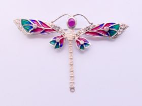 A silver dragonfly brooch. 7 cm x 4.5 cm.