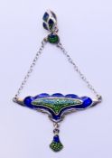 A silver Art Nouveau style pendant. 7 cm high.