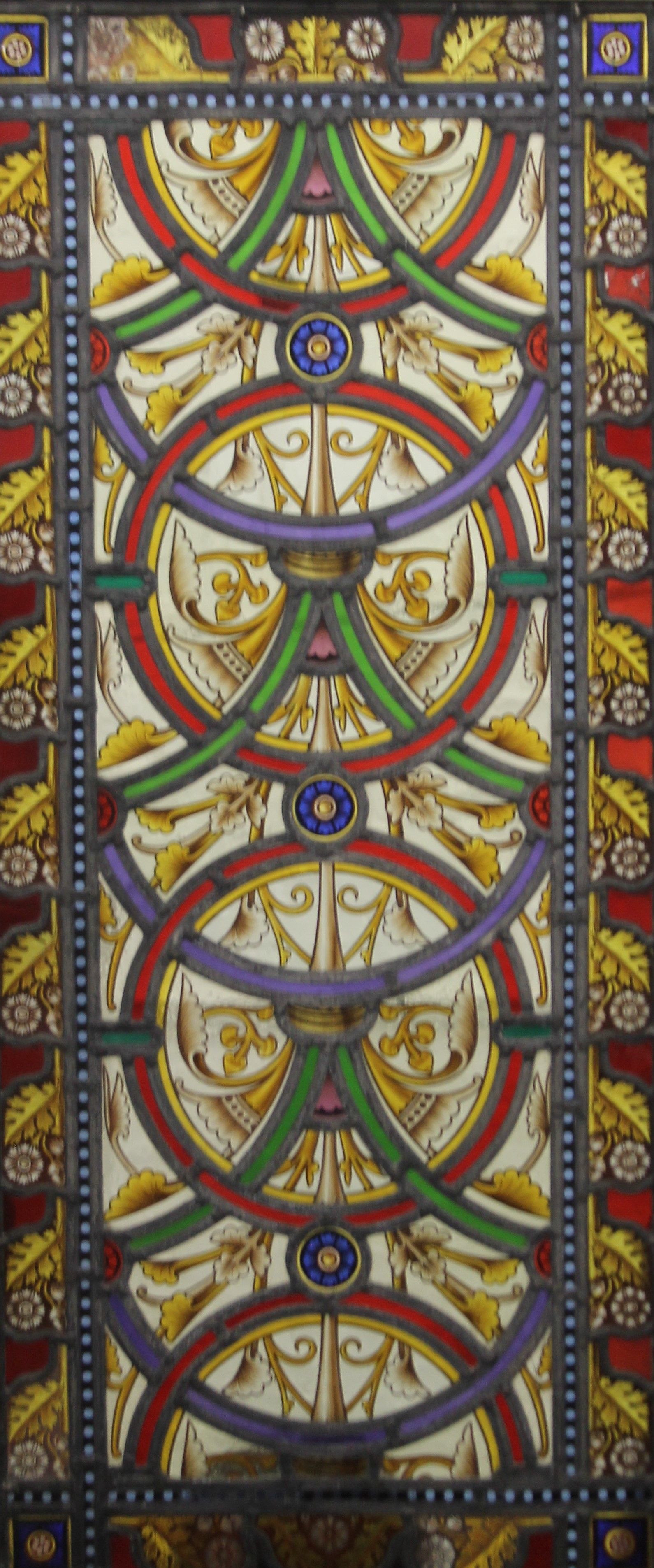 A Victorian lead glazed stained glass panel, with later frame. 51 x 112 cm.