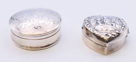A round silver pill box inscribed to base 'Mum with love Xmas 90' and a heart shaped embossed